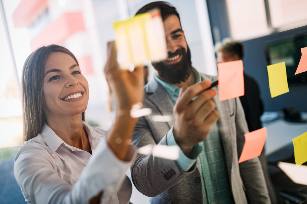 Business people collaborating on a Six Sigma project in an office