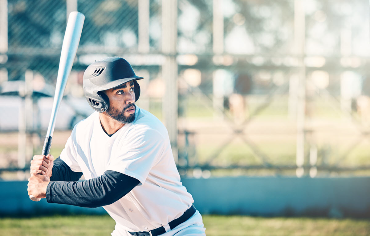 A baseball player, positioned according to a Six Sigma-designed experiment, ready to hit a pitch.