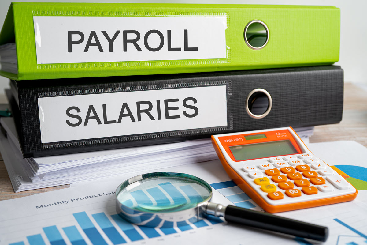 Binders labeled payroll and salaries