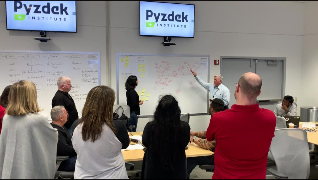 Pyzdek Institute instructor teaching cost reduction methods on-site.